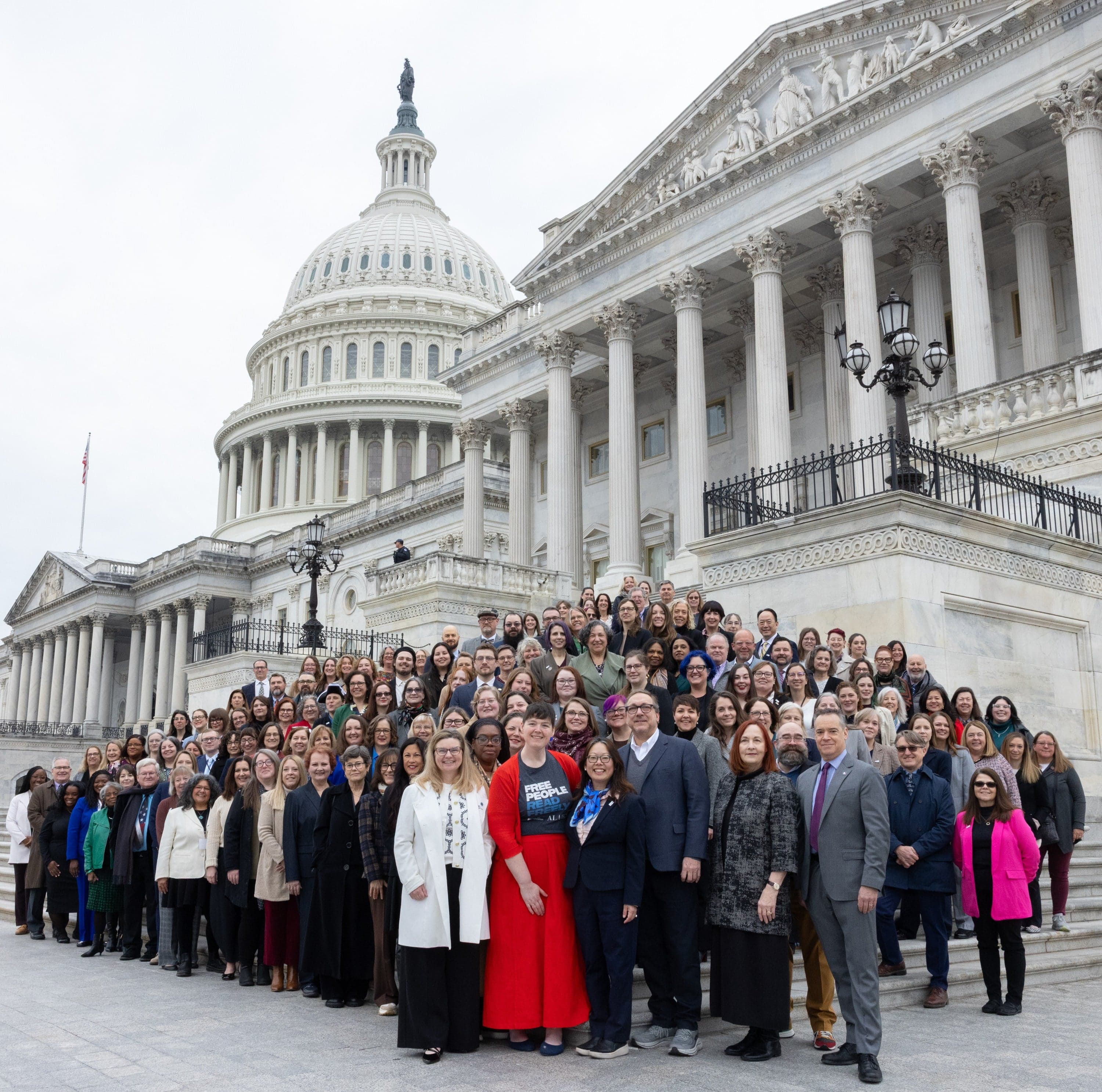 American Library Association advocates stand on the steps of the U.S. Capitol at National Library Legislative Day